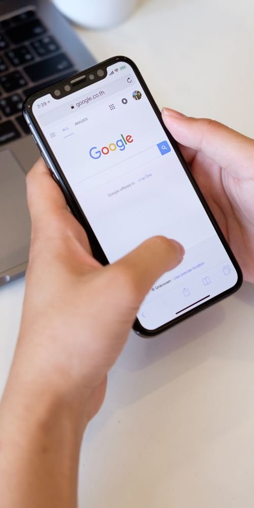 Smartphone displaying Google search results, highlighting SEO and digital visibility strategies for businesses”