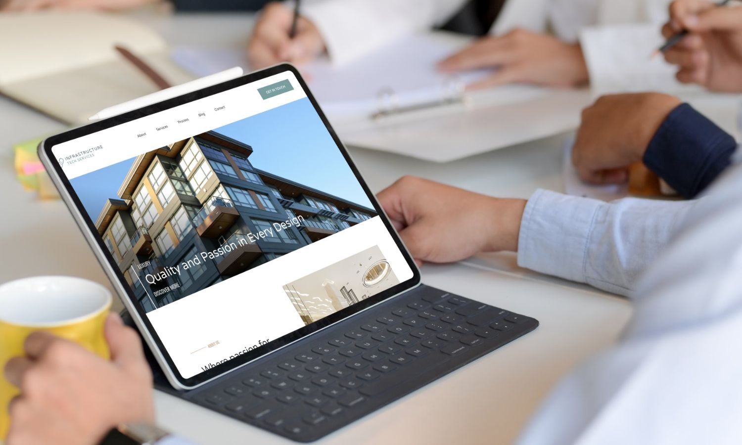 Laptop on a desk displaying a beautifully designed architecture website, representing Infrastructure Tech Services’ specialized custom web design for architects.